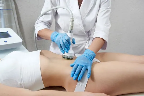 Lost the Weight but Not the Loose Skin? 2 woman having HIFU treatment on her stomach to combat loose skin Somerset following weight loss